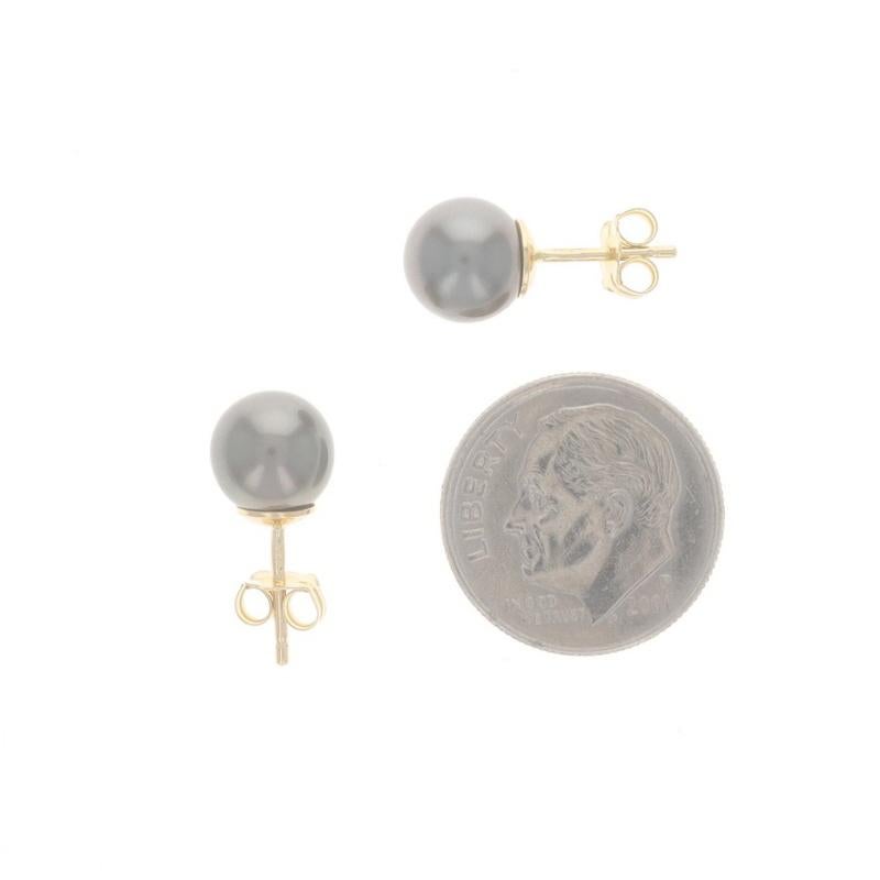Metal Content: 18k Yellow Gold

Stone Information

Cultured Pearls
Color: Grey
Size: 7.8mm & 7.7mm
Stone Note: Tahitian

Style: Stud
Fastening Type: Butterfly Closures

Measurements

Item 1: Earring 1
Diameter: 5/16