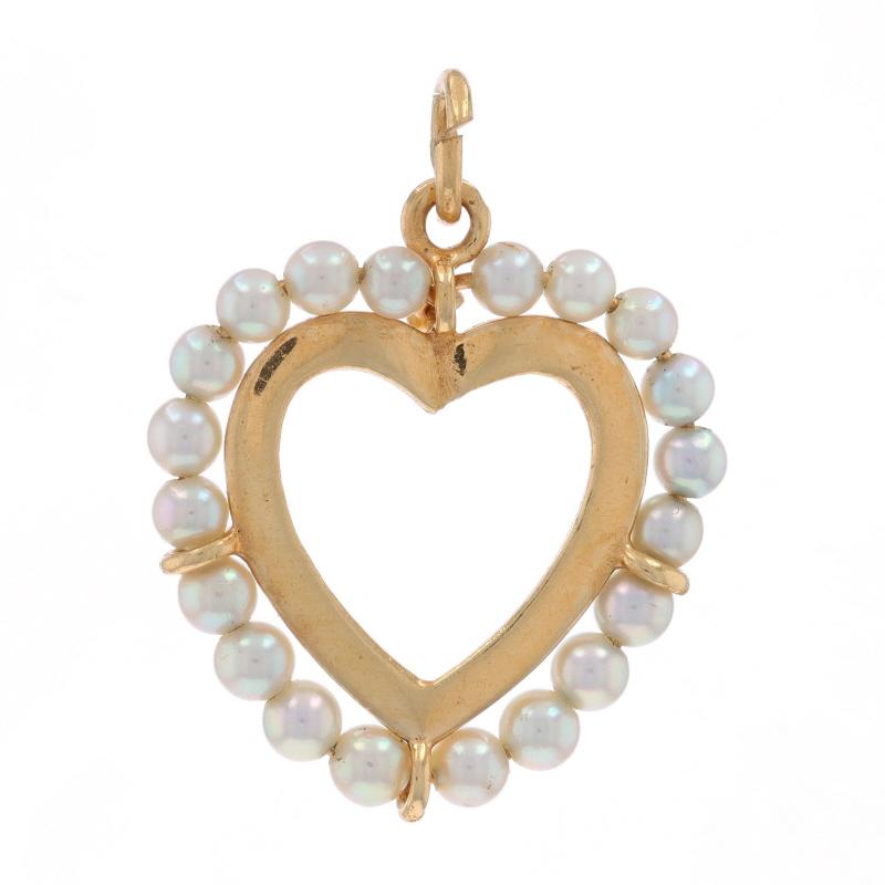 Era: Vintage

Metal Content: 14k Yellow Gold

Stone Information

Cultured Pearls

Theme: Heart, Love Wreath

Measurements

Tall (from stationary bail): 31/32