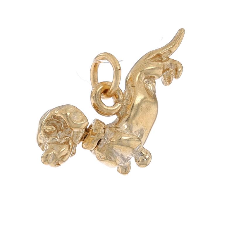 Metal Content: 14k Yellow Gold

Theme: Dachshund Dog, Pet Canine
Features: The canine's head rotates around.

Measurements

Tall: 7/16