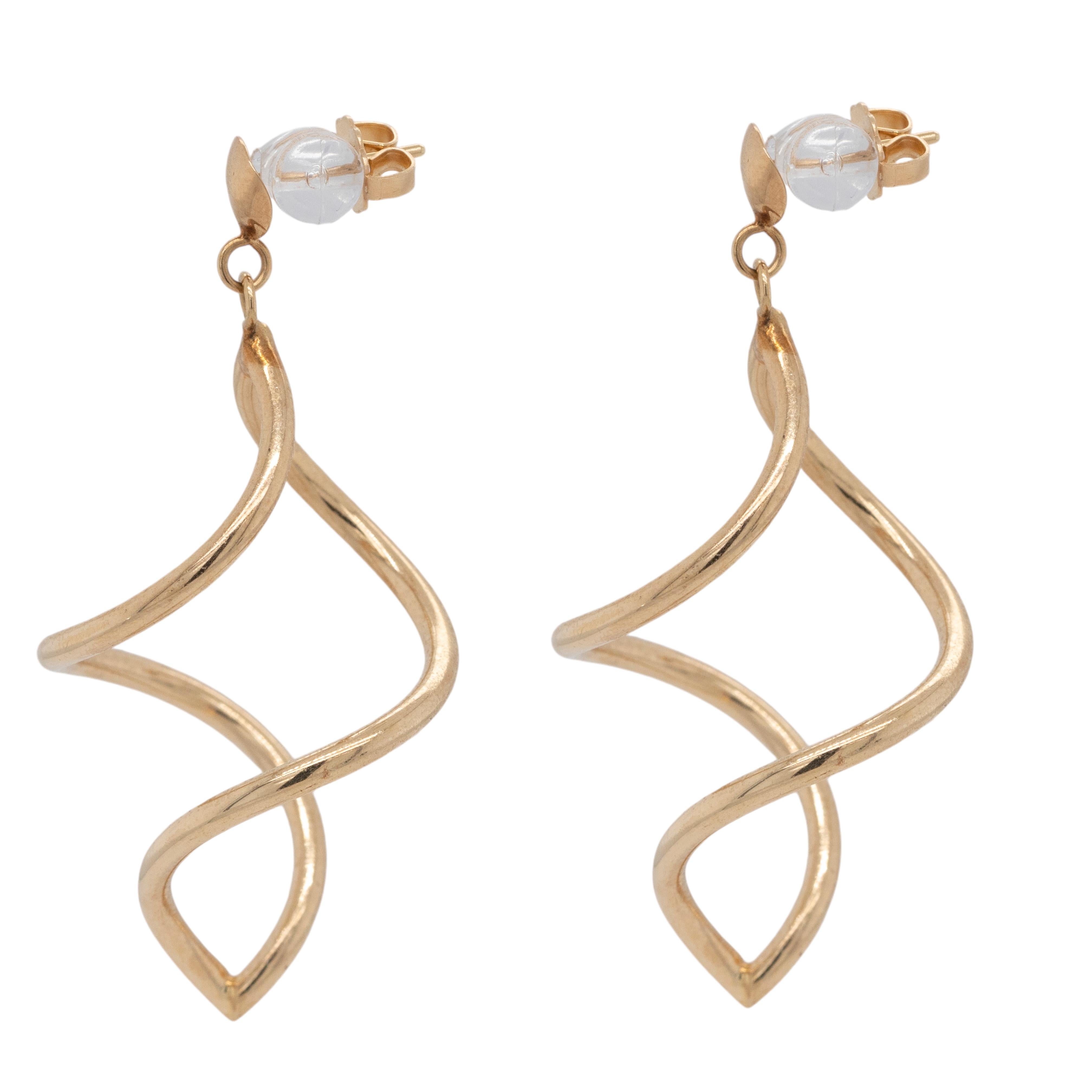 Illuminate your look with these exquisite 14k Yellow Gold Twist Dangle Earrings. Their elegant twist design creates a captivating movement, allowing the warm glow of yellow gold to shimmer with every turn. With a weight of just 3.1 grams, these