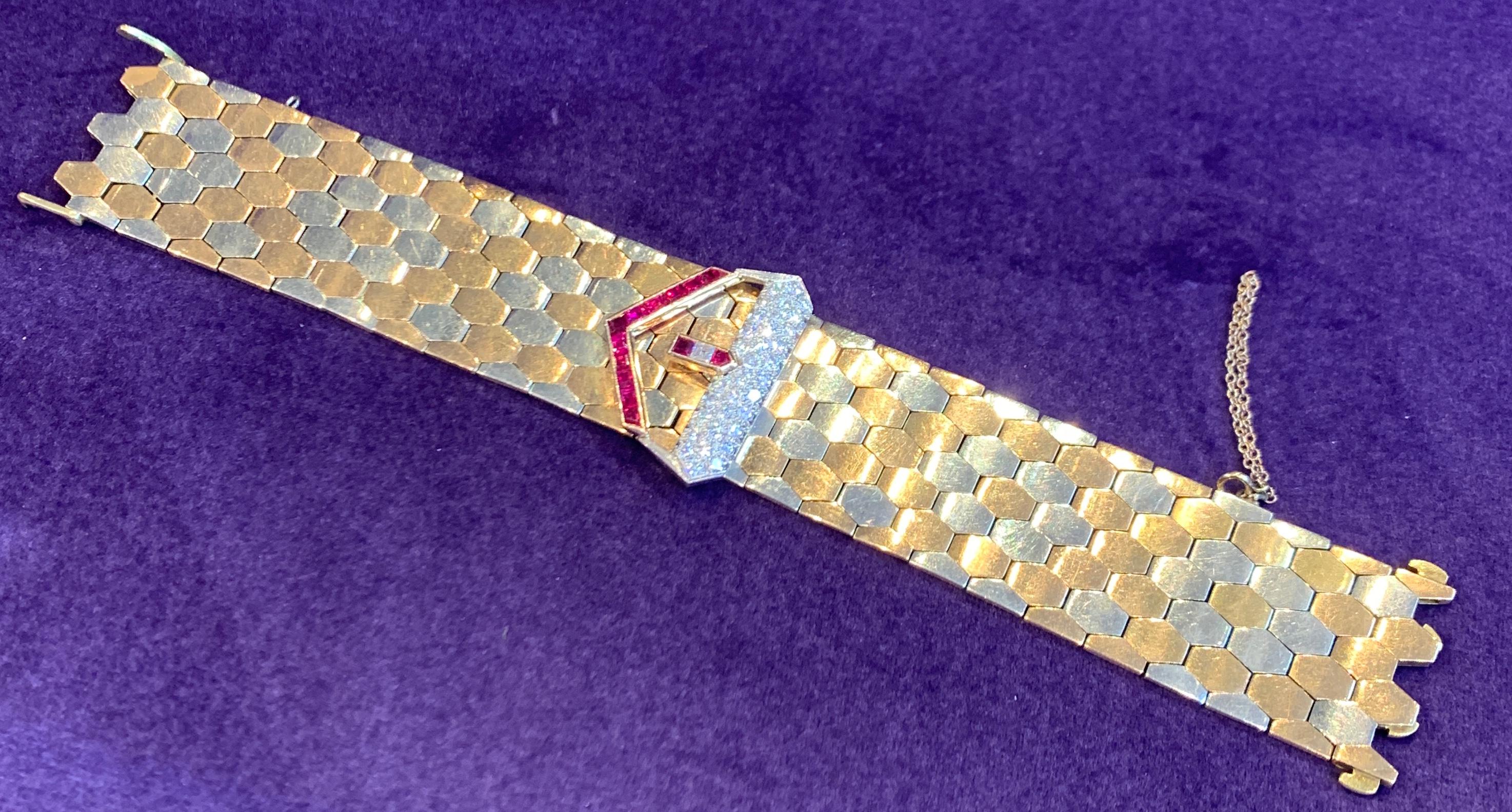 Yellow Gold Diamond and Ruby Buckle Retro Bracelet Circa 1940
83.3 Grams
18K Two Tone Gold
Length: 7