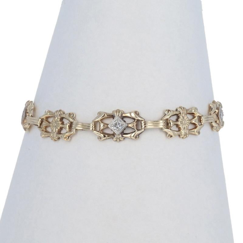 Era: Art Deco

Metal Content: 14k Yellow Gold & 10k Yellow Gold

Stone Information

Natural Diamonds
Carat(s): .20ctw
Cut: Round Brilliant
Color: G - H
Clarity: VS1 - VS2

Total Carats: .20ctw

Bracelet Style: Link
Fastening Type: Spring Ring