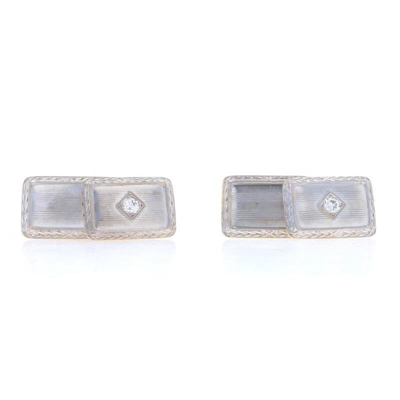 Era: Art Deco
Date: 1920s - 1930s

Metal Content: 14k Yellow Gold with Platinum (tops)

Stone Information

Natural Diamonds
Carat(s): .30ctw
Cut: European
Color: H - I
Clarity: VS1 - VS2

Total Carats: .30ctw

Style: Cufflinks
Features: Etched