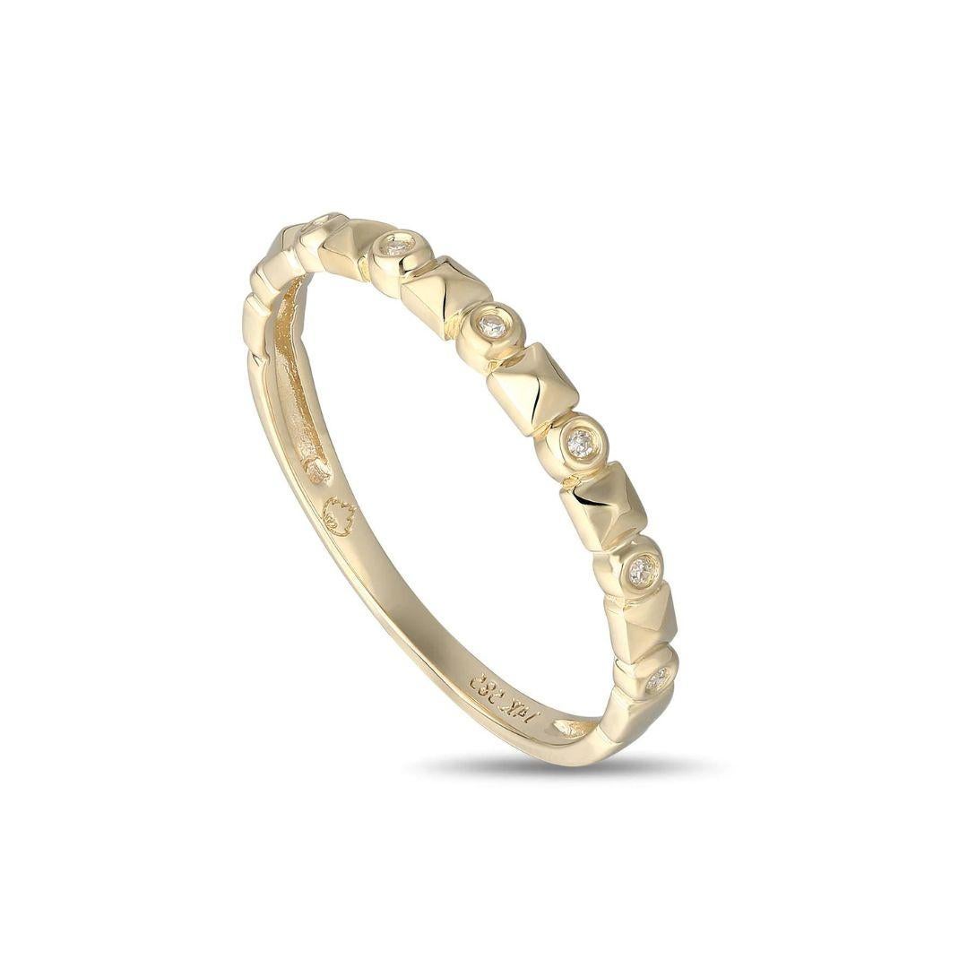 Fashionable diamond studded band in 14k yellow gold. Wear on its own or layer it with other stackable bands. Band contains seven round white diamonds, H-I color, SI clarity, 0.02 ctw. Stock band size 6, available in other sizes per request.
