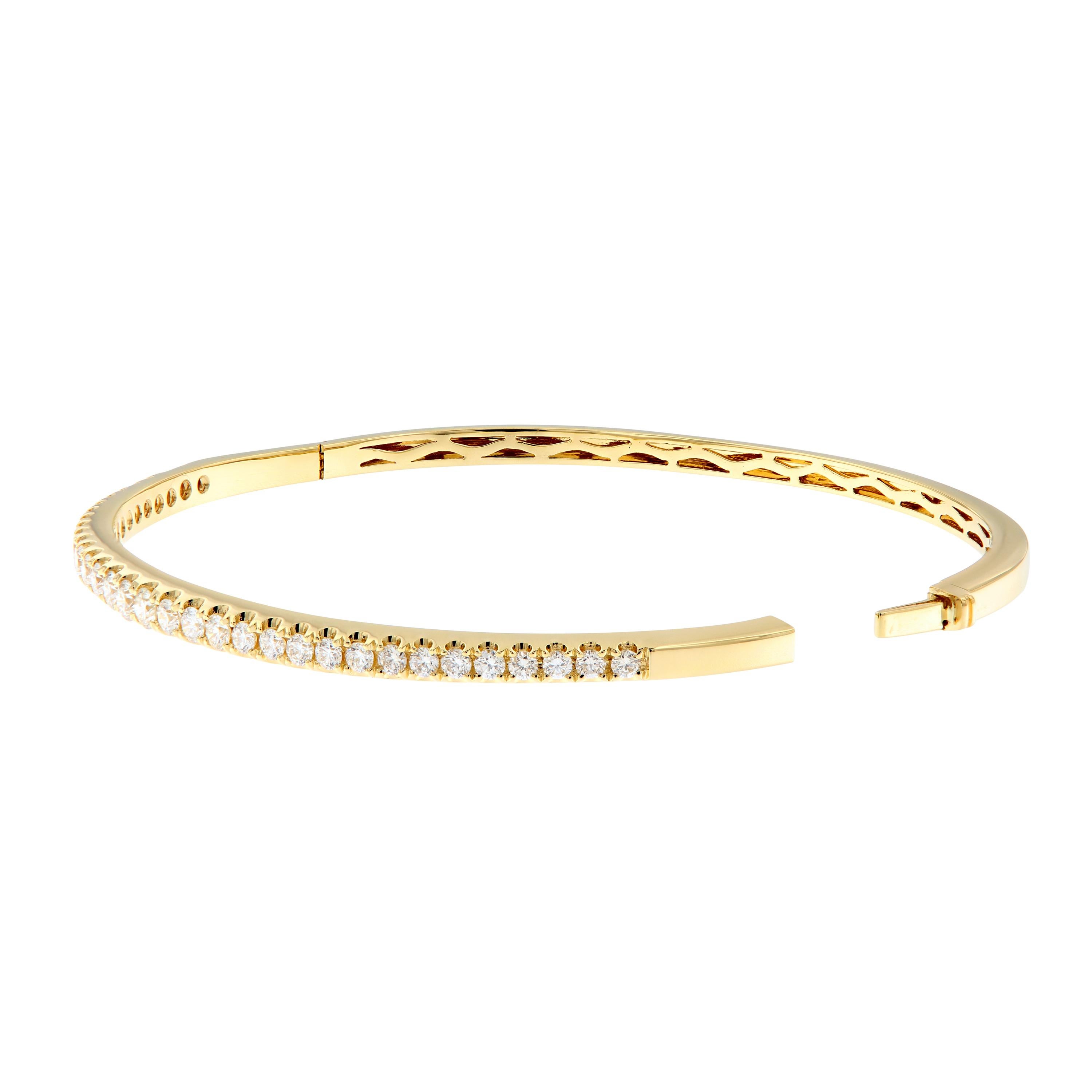 A classic bracelet beautifully crafted in 18k yellow gold features 34 sparkling diamonds. Striking on its own or stack two or more to create a bolder look. This bracelet fits PERFECTLY with a 17 Cartier Love Bracelet! Inner diameter is 2.25