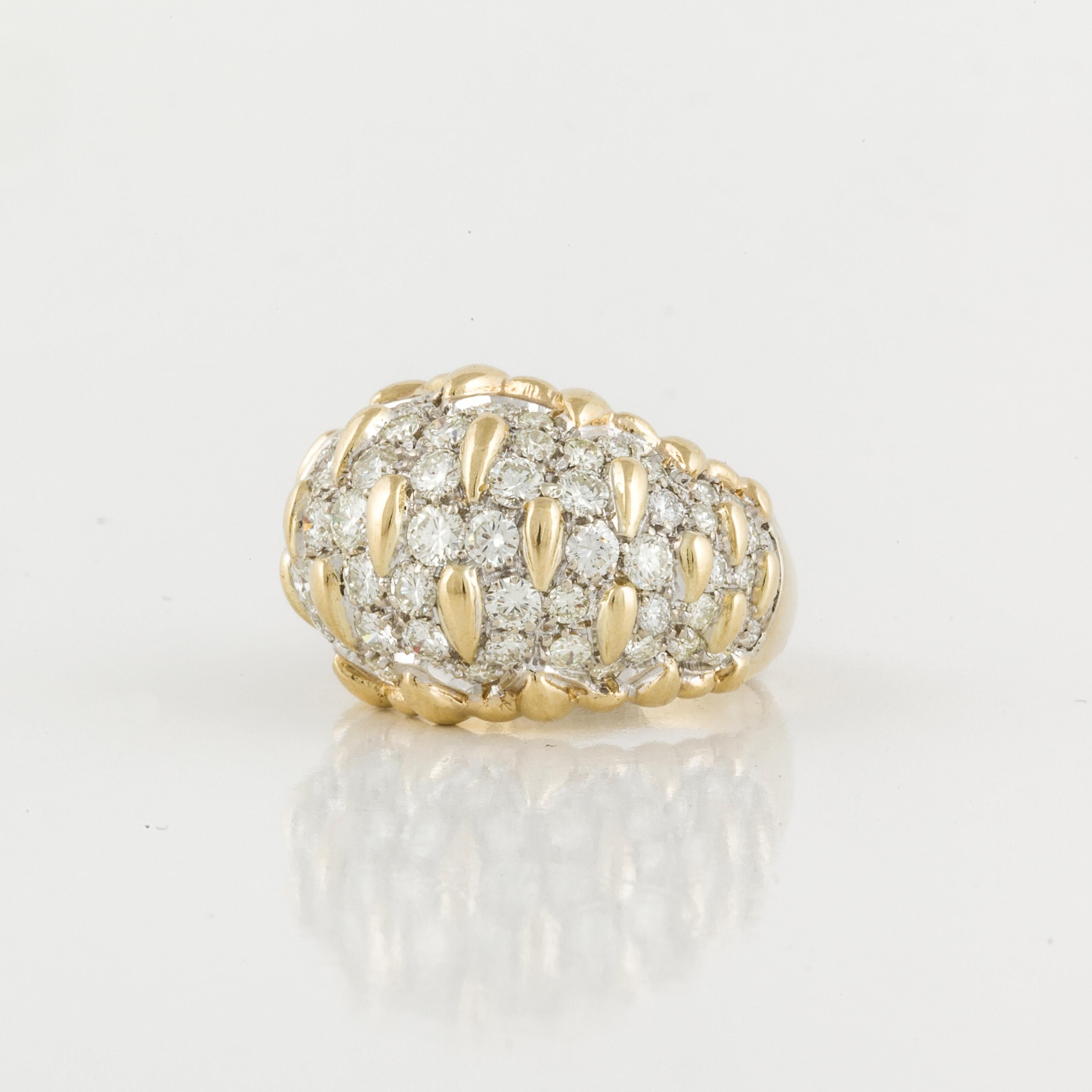 18K yellow gold bombé style ring with 50 round diamonds totaling 3.50 carats; H-J color and VS1-SI1 clarity.  Ring is currently a size 8.  Measures 7/8 inches by 5/8 inches and stands 3/8 inches off the finger.