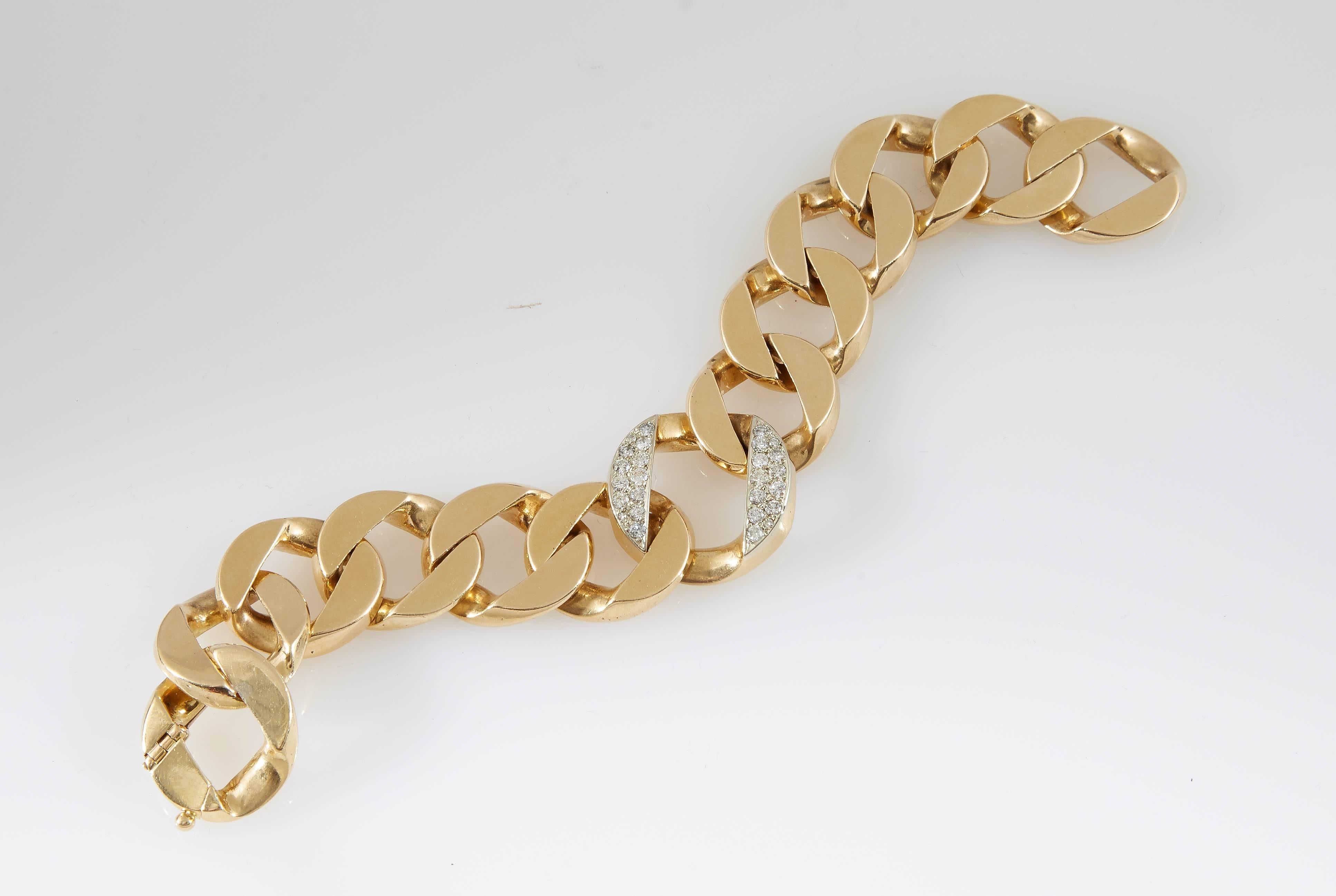 Beautiful curbed link bracelet, finely crafted in 14 k yellow gold with fine quality diamonds at the center,  weighing a total of approximately 1.00 cts. 
The bracelet is uniquely and elegantly. 
Chic and bold!!!