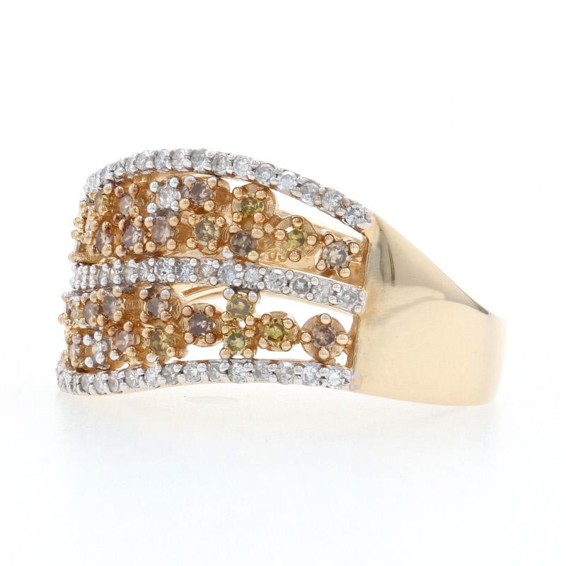 Light up the night wearing this vivacious diamond ring! Composed of 14k yellow and white gold, this NEW piece showcases a gracefully curved band adorned with a sparkling array of champagne brown, fancy intense yellow, and white diamonds.   
 
This