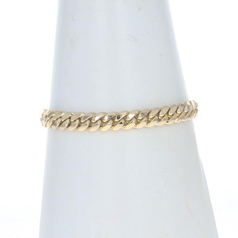 Metal Content: 14k Yellow Gold

Chain Style: Diamond Cut Curb
Bracelet Style: Chain
Fastening Type: Tab Box Clasp with Two Side Safety Clasps

Measurements

Length: 9
