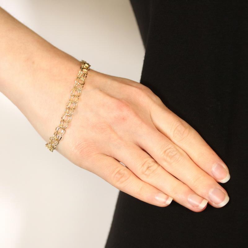 Metal Content: 14k Yellow Gold

Bracelet Style: Starter Charm Chain 
Chain Style: Diamond Cut Double Curb
Fastening Type: Tab Box Clasp with One Side Safety Clasp

Measurements
Length: 7 3/4