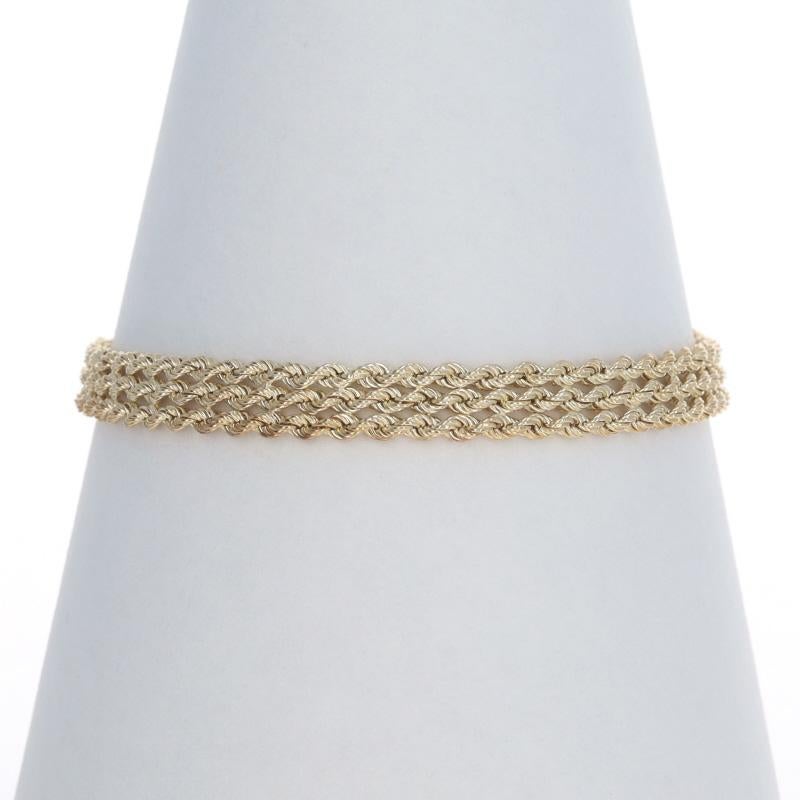 Metal Content: 14k Yellow Gold

Chain Style: Diamond Cut Rope
Bracelet Style: Three Strand Chain
Fastening Type: Lobster Claw Clasp

Measurements

Chain Width: 9/32