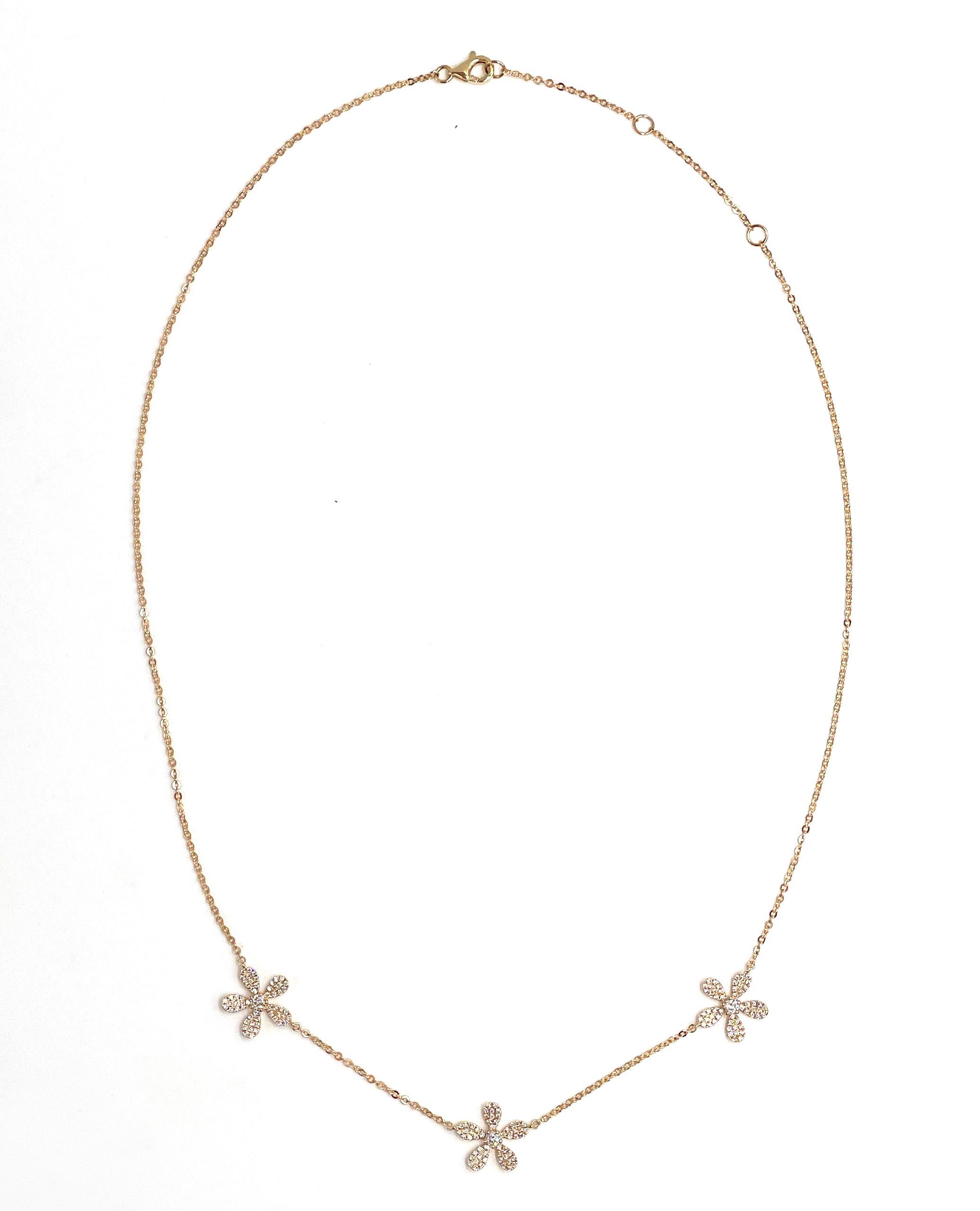 14K yellow gold flower necklace with 0.62 carat diamonds. 

- Can be worn 16, 17 or 18 inches long.