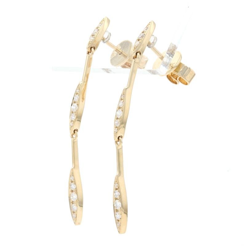 Metal Content: 14k Yellow Gold 

Stone Information: 
Natural Diamonds
Total Carats: .20ctw 
Cut: Round Brilliant 
Color: G 
Clarity: VS2 - SI1 

Style: Dangle 
Fastening Type: Butterfly Closures 

Measurements: 
Tall: 1 1/2