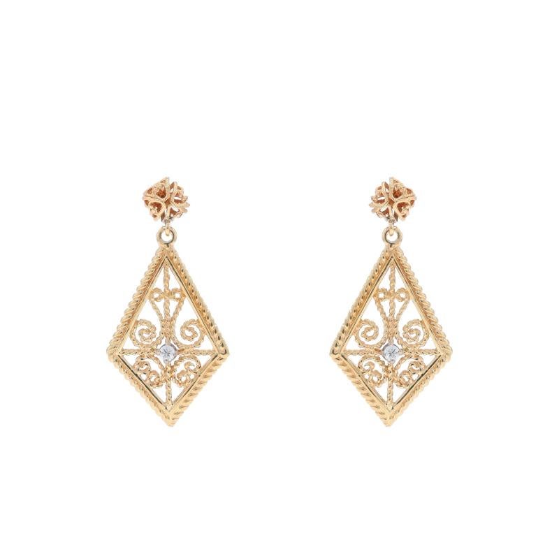 Metal Content: 14k Yellow Gold & 14k White Gold

Stone Information

Natural Diamonds
Carat(s): .10ctw
Cut: Round Brilliant
Color: G
Clarity: SI1 - SI2

Total Carats: .10ctw

Style: Dangle
Fastening Type: Butterfly Closures
Theme: Scrollwork