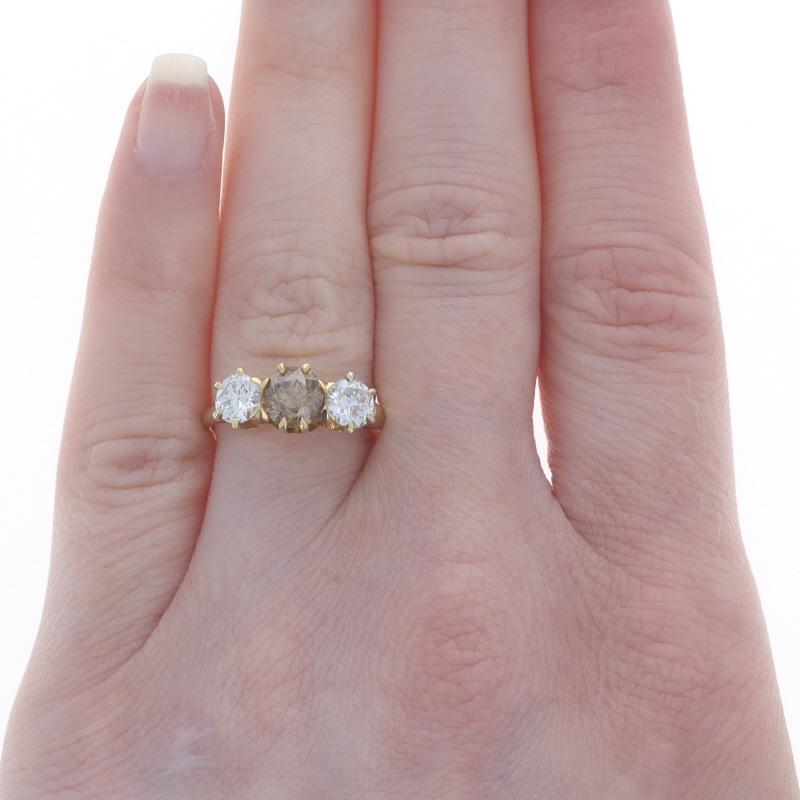 Size: 6 3/4
Sizing Fee: Up 2 sizes for $50 or Down 1 1/2 sizes for $30

Era: Art Deco
Date: 1920s - 1930s

Metal Content: 18k Yellow Gold

Stone Information

Natural Diamond
Carat(s): 1.01ct
Cut: European
Color: Fancy Brown
Clarity: I1