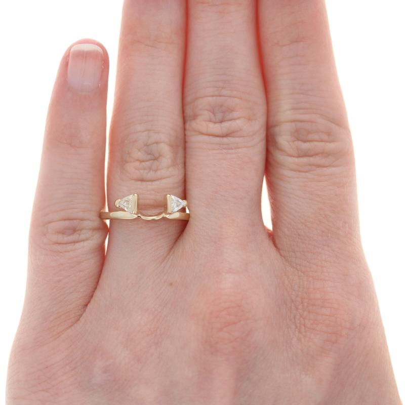 Size: 6
Sizing Fee: Down 2 sizes for $30 or up 2 for $35

Metal Content: 14k Yellow Gold

Stone Information
Natural Diamonds
Total Carats: .30ctw
Cut: Trillion
Color: G - H
Clarity: SI2 - I1

Center Opening (east to west): 4.8mm

Style: Enhancer