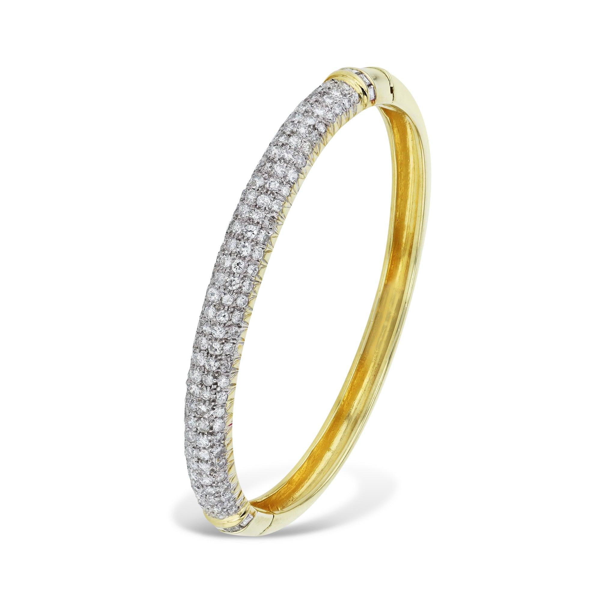 Be dazzled by this 18kt Yellow Gold Diamond Estate Hinge Bracelet! This beautiful piece boasts 132 Round diamonds and 10 Baguette diamonds for a dazzling grand total. A must-have for the Estate Collection!
Yellow Gold Diamond Estate Hinge