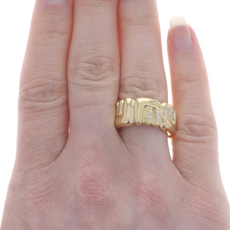 Size: 6

Metal Content: 18k Yellow Gold

Stone Information

Natural Diamonds
Carat(s): .24ctw
Cut: Round Brilliant
Color: G - H
Clarity: I1 - I2

Total Carats: .24ctw

Style: Eternity Band
Theme: Initial E Letter

Measurements

Face Height (north to