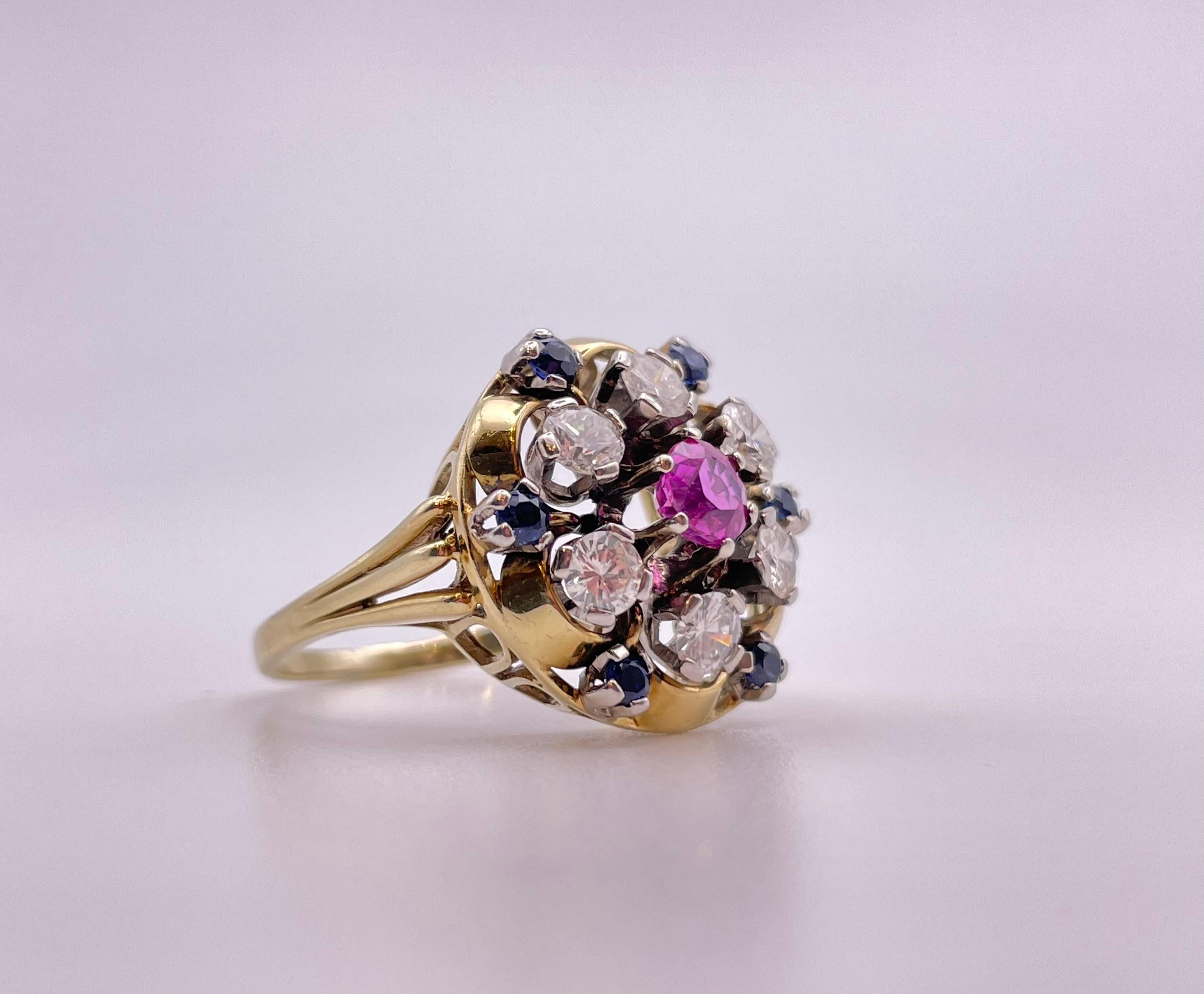 18k yellow gold ring with center brilliant cut ruby ( Burma ) , approximately .30 ct surrounded by 6 brilliant diamonds approximately 1.20 ct . 
period : 1950
origin : italy