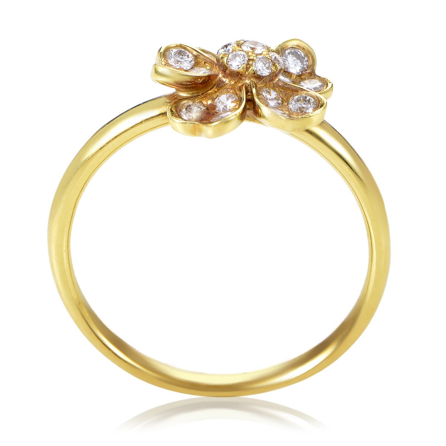 Shine with effortlessly chic style as you don this lovely ladies ring. The yellow gold band base is flawlessly shaped, setting off the intricate beauty of the flower-shaped top highlighted by an array of white diamonds weighing in total 0.36ct.<br