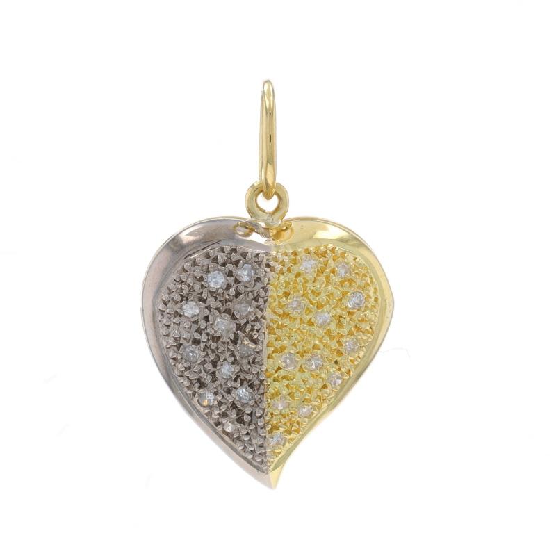 Metal Content: 18k Yellow Gold & 18k White Gold

Stone Information

Natural Diamonds
Carat(s): .20ctw
Cut: Single
Color: G - H
Clarity: I1 - I2

Total Carats: .20ctw

Style: Cluster
Theme: Heart, Love

Measurements

Tall (from stationary bail): 7/8