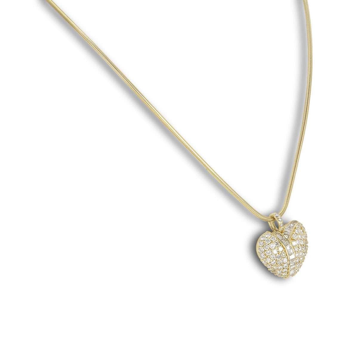 An 18k yellow gold diamond heart pendant. The heart is set with both round brilliant cut and baguette cut diamonds with a total weight of approximately 2.12ct. The heart measures 2.2cm in width and 2.5cm in length, including the bale. The necklace