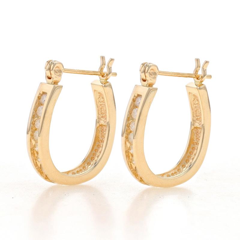 Metal Content: 14k Yellow Gold

Stone Information
Natural Diamonds
Carat(s): .24ctw
Cut: Round Brilliant
Color: H - I
Clarity: I2 - I3

Total Carats: .24ctw

Style: Hoop
Fastening Type: Snap Closures
Features: Channel Set Stones

Measurements
Tall: