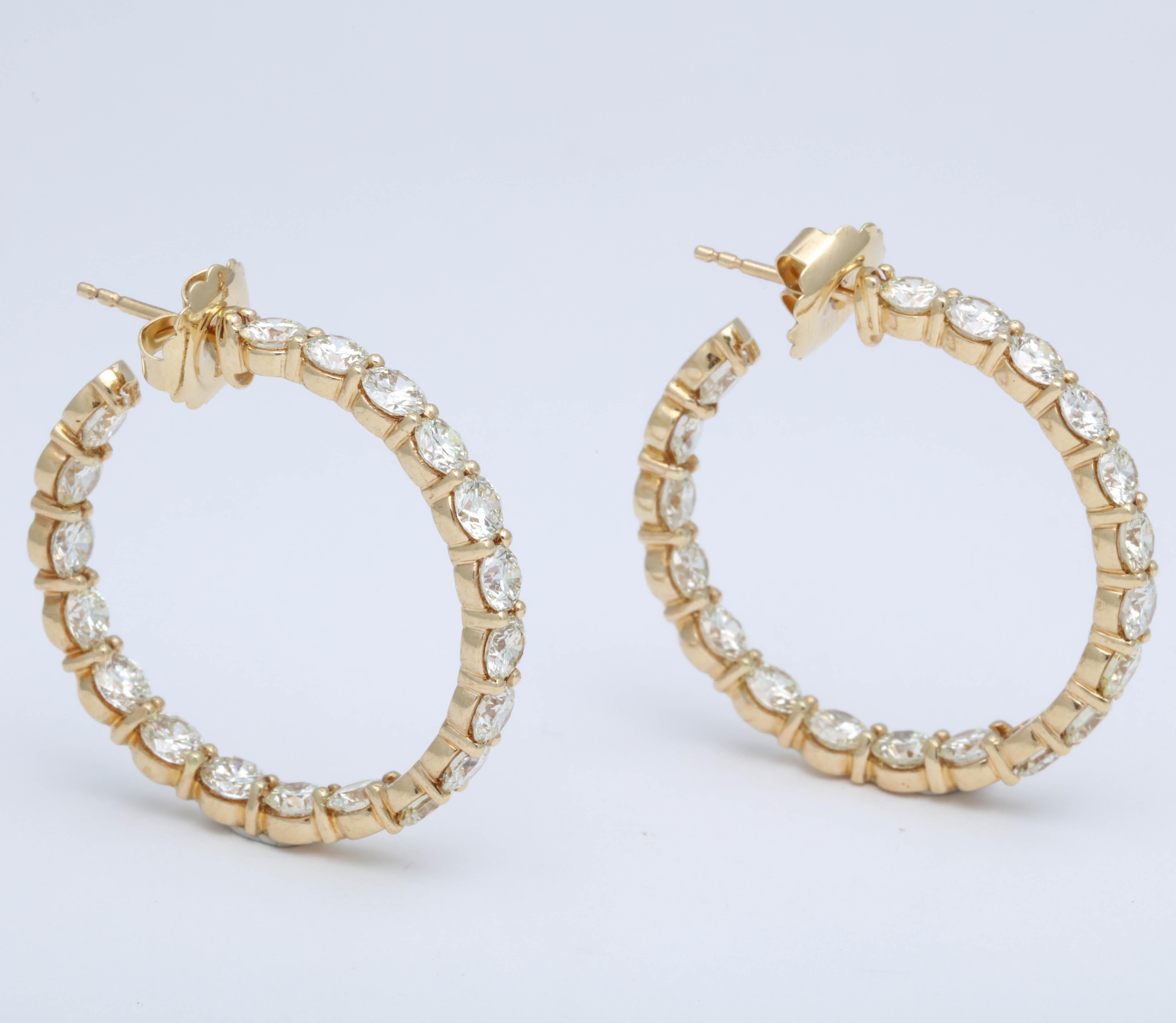 

An amazing pair of important Diamond Hoop Earrings with LARGE white diamonds!

13.20 carats of round brilliant cut white diamonds set in 18k yellow gold. 

Each diamond averages over 0.30 carats. 

The hoops were custom designed in New York --