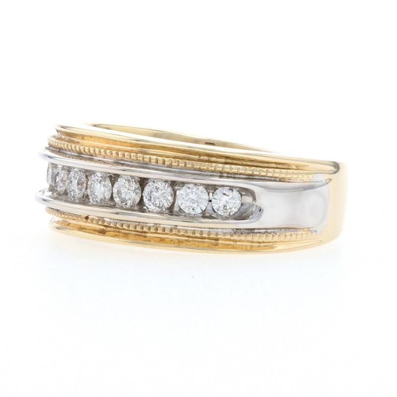 Celebrate your everlasting love and commitment with this exceptional wedding band! Crafted in 14k yellow and white gold, this ring showcases a sparkling row of white diamonds set across the band's face and outlined by two milgrain borders. 
 
 This