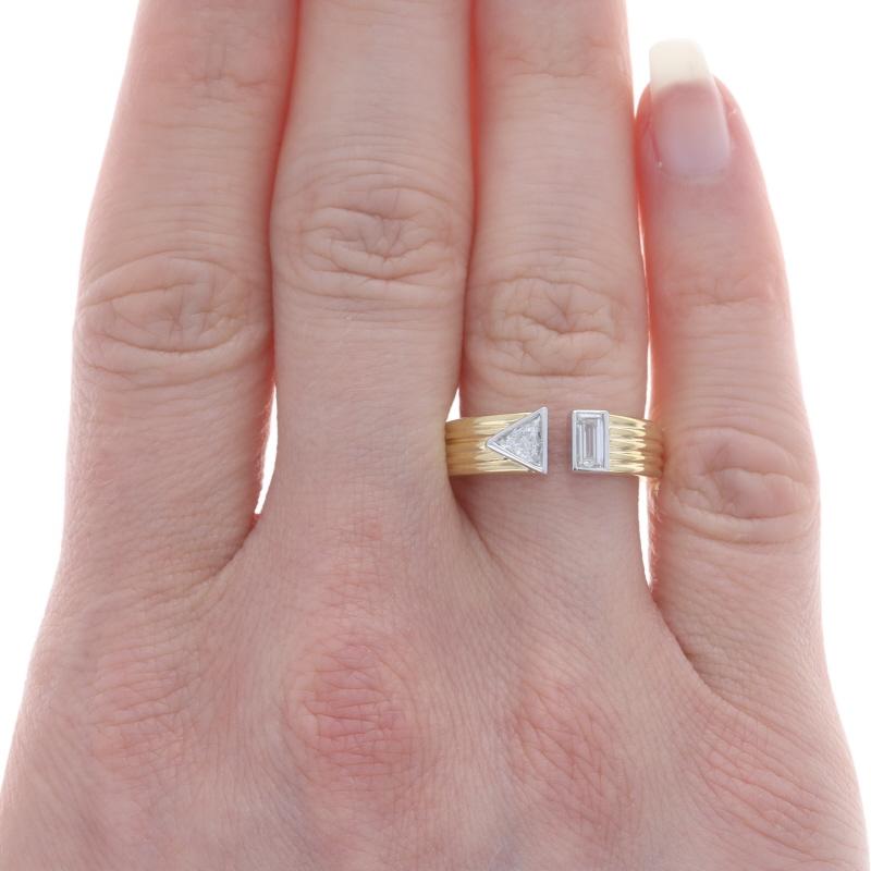 Size: 6 3/4
Note: Though the ring is not sizable, it can be slightly adjusted.

Metal Content: 18k Yellow Gold & 18k White Gold

Stone Information
Natural Diamonds
Carat(s): .43ctw
Cut: Trillion & Baguette
Color: H
Clarity: VS1 - VS2

Total Carats: