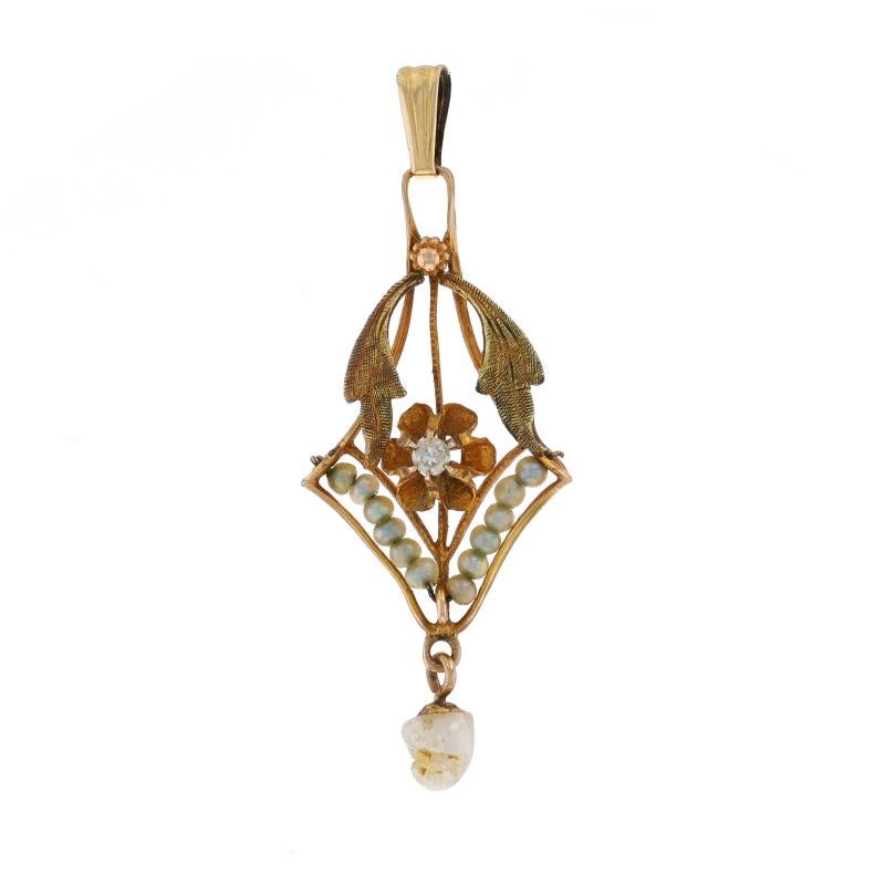 Era: Art Deco
Date: 1920s - 1930s

Metal Content: 10k Yellow Gold (pendant) & 12k Gold Filled (bail)

Stone Information
Natural Diamond
Cut: Single
Stone Note: (one small accent)

Natural Seed Pearls

Style: Lavaliere
Theme: Floral
Features: Etched
