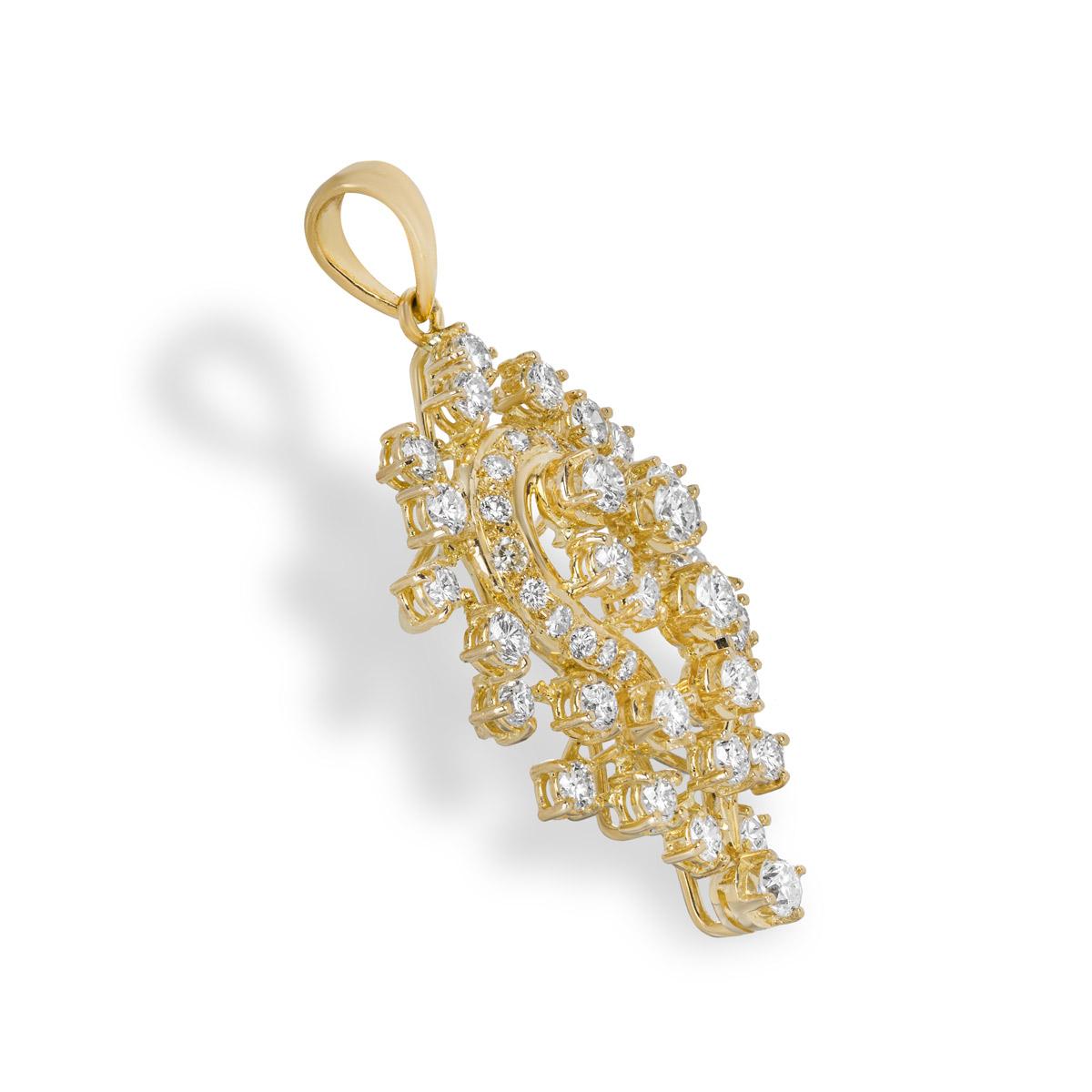 An intricate 18k yellow gold diamond pendant. The pendant is set with 48 round brilliant cut diamonds with an approximate total weight of 2.47ct, G-H colour and SI clarity. The pendant measures 4.2cm in length (including the bail) and 2.0cm in width