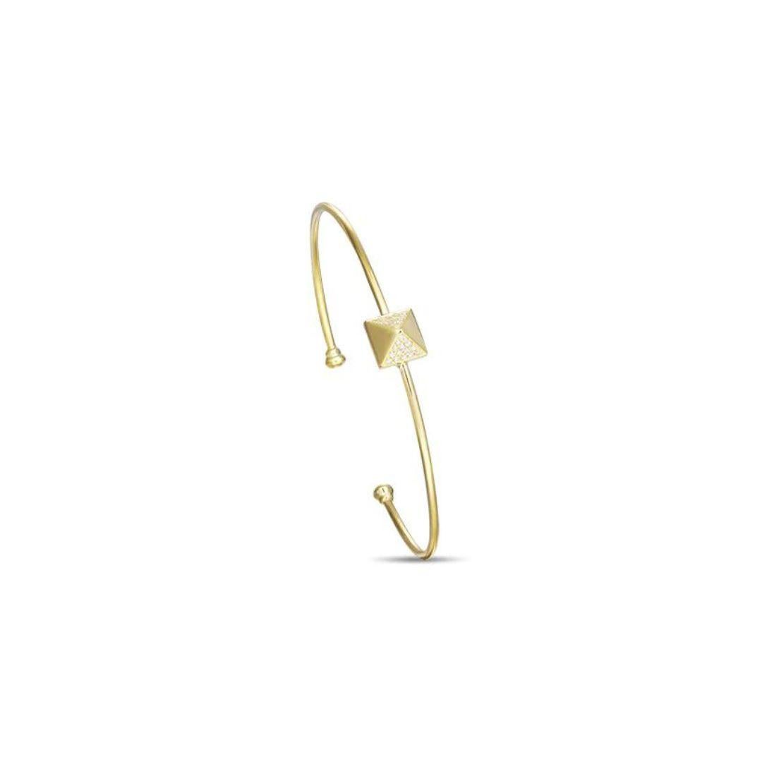 Stylish 14k yellow gold bangle. Bangle features a trendy pyramid element with pave set round brilliant diamonds. Perfect to wear on its own or stacked with other bangles. Diamonds are H-I color, SI clarity, total carat weight 0.13 ctw. One size fits