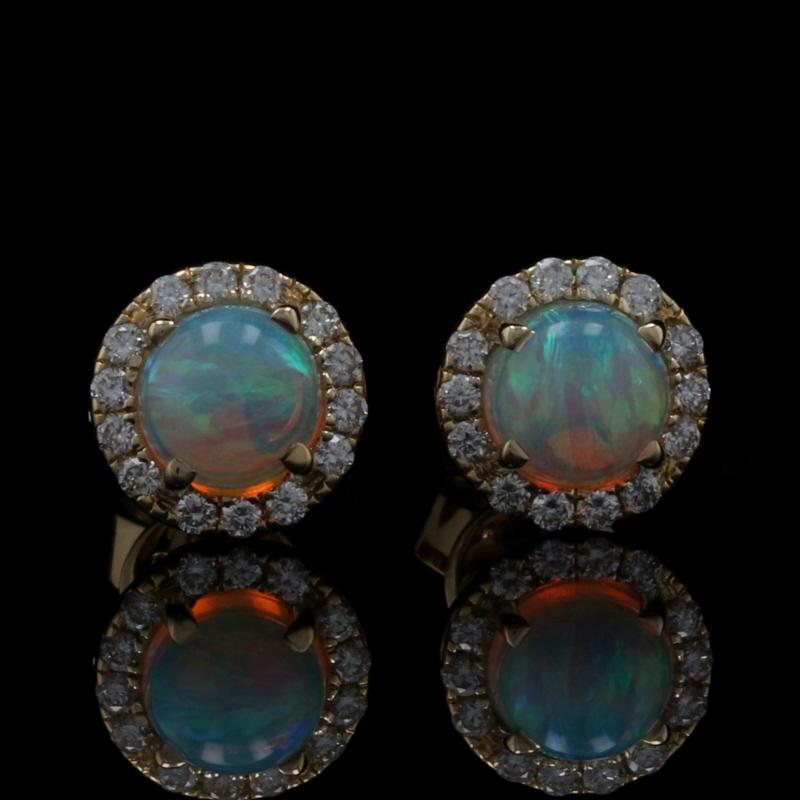 Metal Content: 14k Yellow Gold 

Stone Information: 
Genuine Opals
Carats: .70ctw
Cut: Round Cabochon

Natural Diamonds
Carats: .16ctw
Cut: Round Brilliant 
Color: G
Clarity: SI1 

Total Carats: .86ctw 

Style: Halo Stud 
Fastening Type: Butterfly