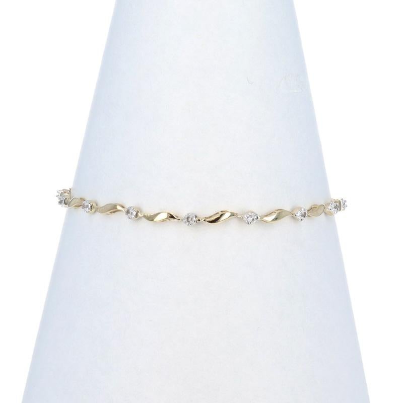 Metal Content: 10k Yellow Gold & 10k White Gold

Stone Information

Natural Diamonds
Carat(s): .15ctw
Cut: Single
Color: J - K
Clarity: I1 - I2

Total Carats: .15ctw

Bracelet Style: Link
Fastening Type: Tongue Box Clasp with One Side Safety
