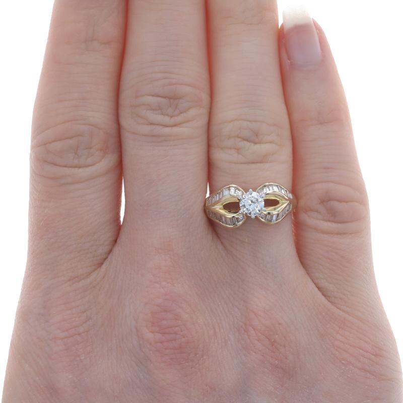 Size: 6 1/4
Sizing Fee: Up 1/2 a size for $30 or Down 1/2 a size for $30

Metal Content: 14k Yellow Gold & 14k White Gold

Stone Information

Natural Diamond
Carat(s): .41ct
Cut: Round Brilliant
Color: K
Clarity: I1

Natural Diamonds
Carat(s):