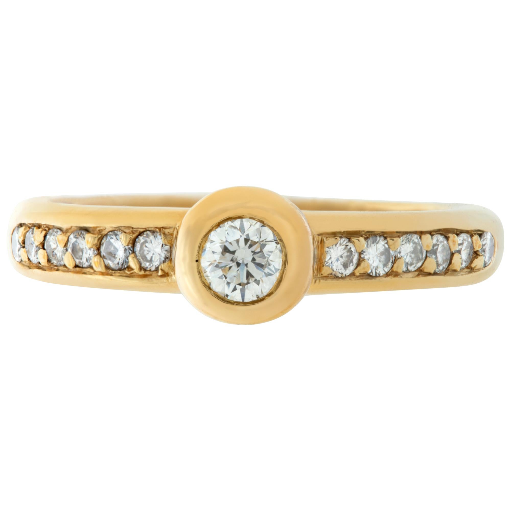 Simple diamond ring center bezel set diamond with side diamond accents total weight approximately 0.50 carat all in 18k yellow gold. Size 5, width 3mm.This Diamond ring is currently size 5 and some items can be sized up or down, please ask! It