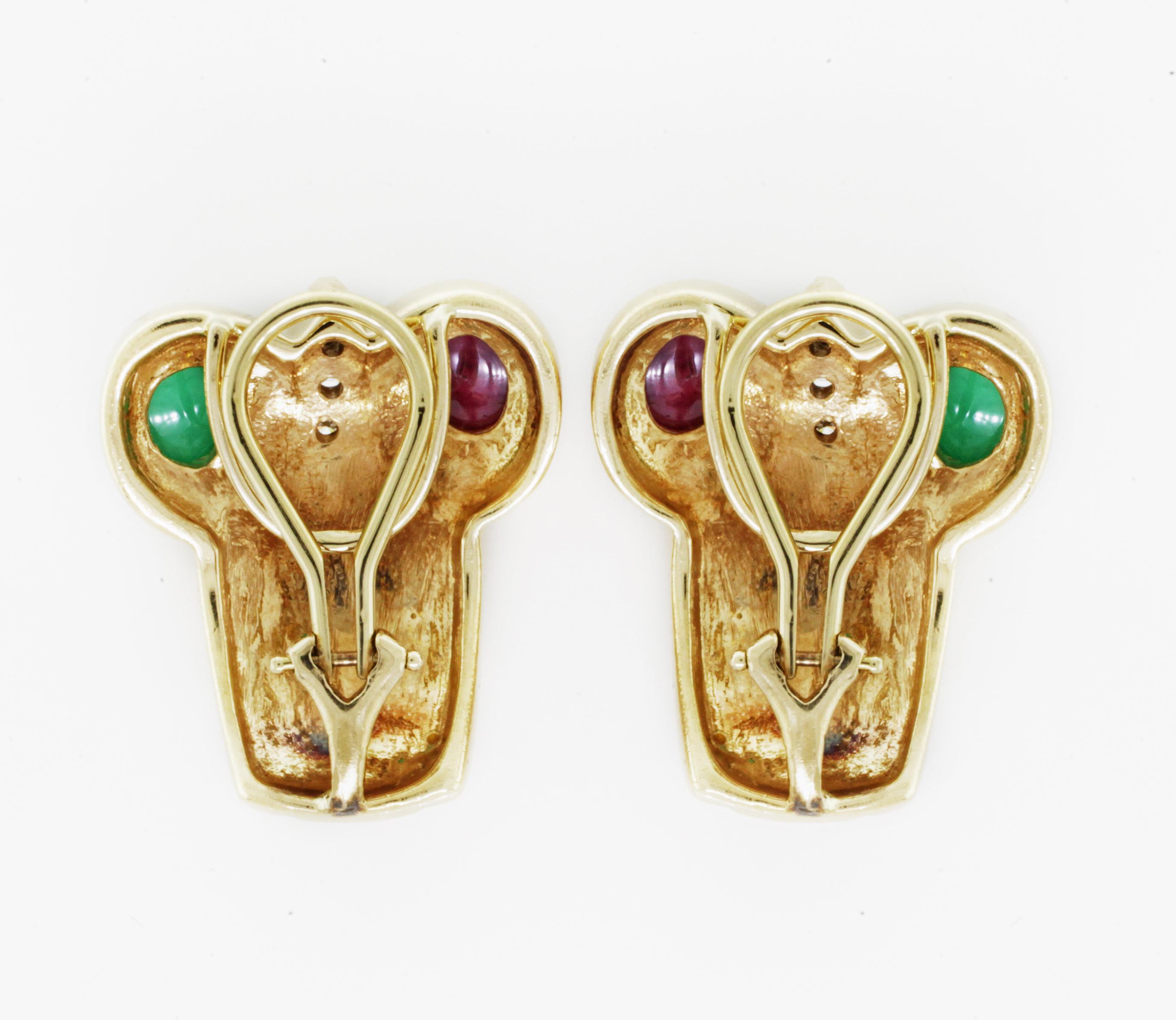 Yellow Gold Diamond Ruby Emerald Ear Clip Earrings

These arty original Retro ear clips from the 1970s are designed with diamonds, rubies and emeralds in 18K yellow gold. They measure 1 inch by by 0.5inch.
Diamond carat weight: 0.06cts approx.
Gems