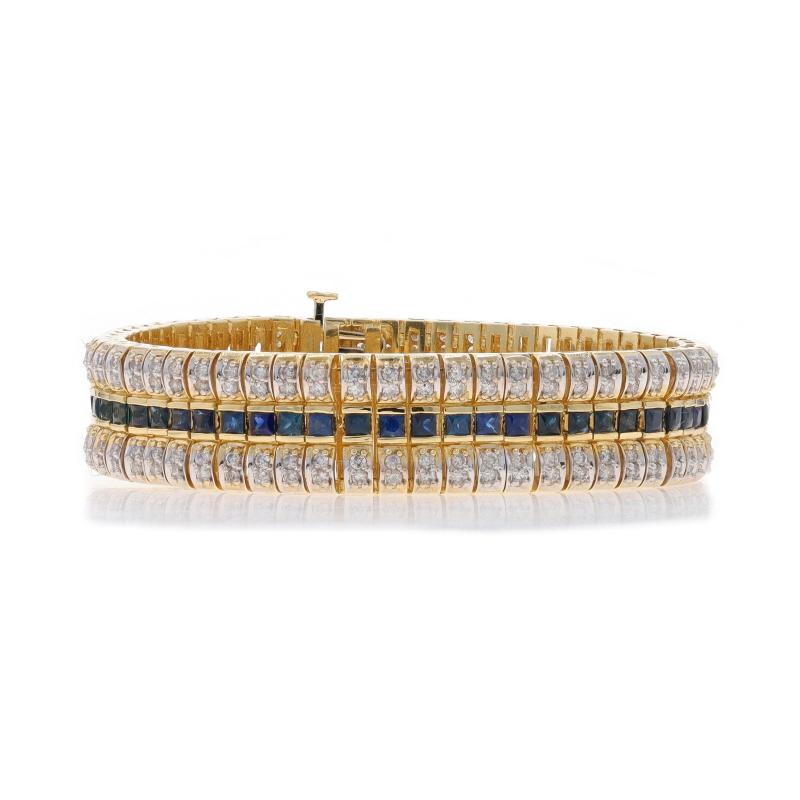 Contenu métallique : Or jaune 14k et or blanc 14k

Informations sur les pierres

Diamants naturels
Carat(s) : 4.72ctw
Coupe : Brillant rond
Couleur : G - H
Clarté : SI2 - I2

Saphirs naturels
Traitement : Chauffage
Carat(s) : 5.90ctw
Coupe :