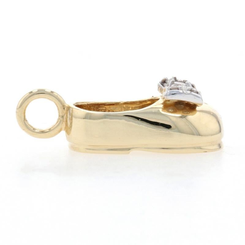 Metal Content: 14k Yellow Gold & 14k White Gold

Stone Information
Natural Diamonds
Total Carats: .06ctw
Cut: Round Brilliant 
Color: G - H
Clarity: I1

Theme: Slip-On Shoe with Bow, Footwear

Measurements
Tall (from stationary bail): 27/32