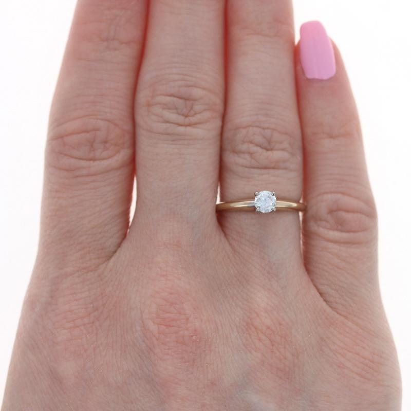 Size: 6
Sizing Fee: Down 3 for $30 or up 2 for $35

Metal Content: 14k Yellow Gold & 14k White Gold

Stone Information
Natural Diamond
Carat(s): .28ct
Cut: Round Brilliant 
Color: K
Clarity: SI2
Diameter: 4.3mm

Style: Solitaire

Measurements
Face