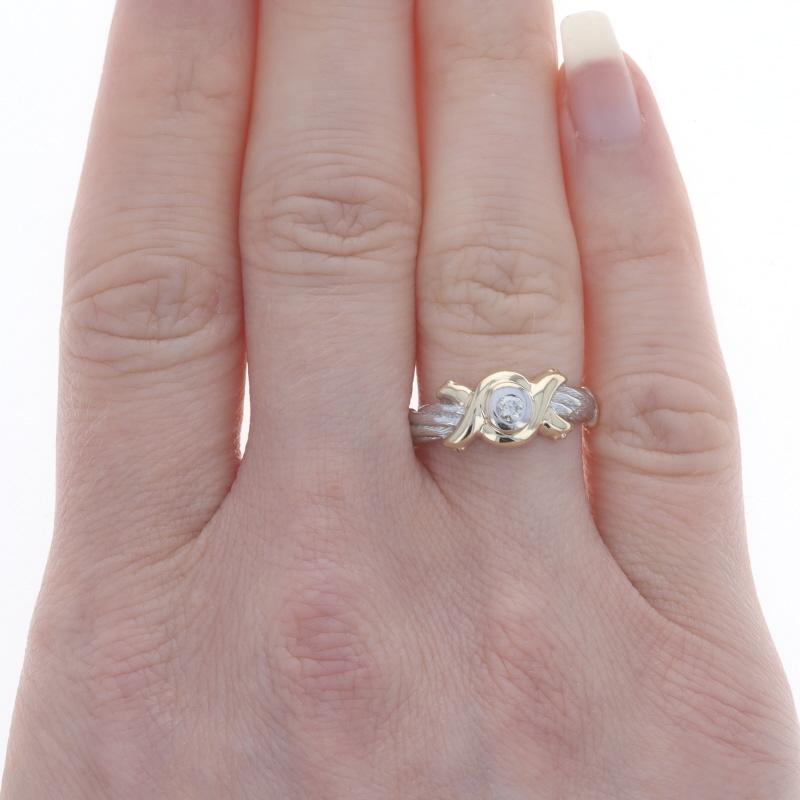 Size: 6 3/4
Sizing Fee: Up 3 sizes for $35 or Down 2 sizes for $30

Metal Content: 10k Yellow Gold & 10k White Gold

Stone Information

Natural Diamond
Carat(s): .06ct
Cut: Round Brilliant
Color: K
Clarity: I1

Style: Solitaire
Features: Textured