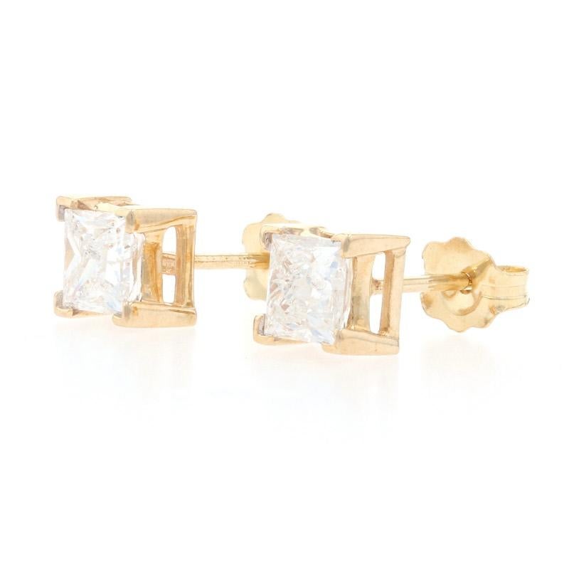 Chic and sophisticated, this radiant pair of earrings are destined to become a signature part of your jewelry wardrobe! These 14k yellow gold stud earrings showcase glittering white diamonds held in classic basket mounts which allow light to cascade