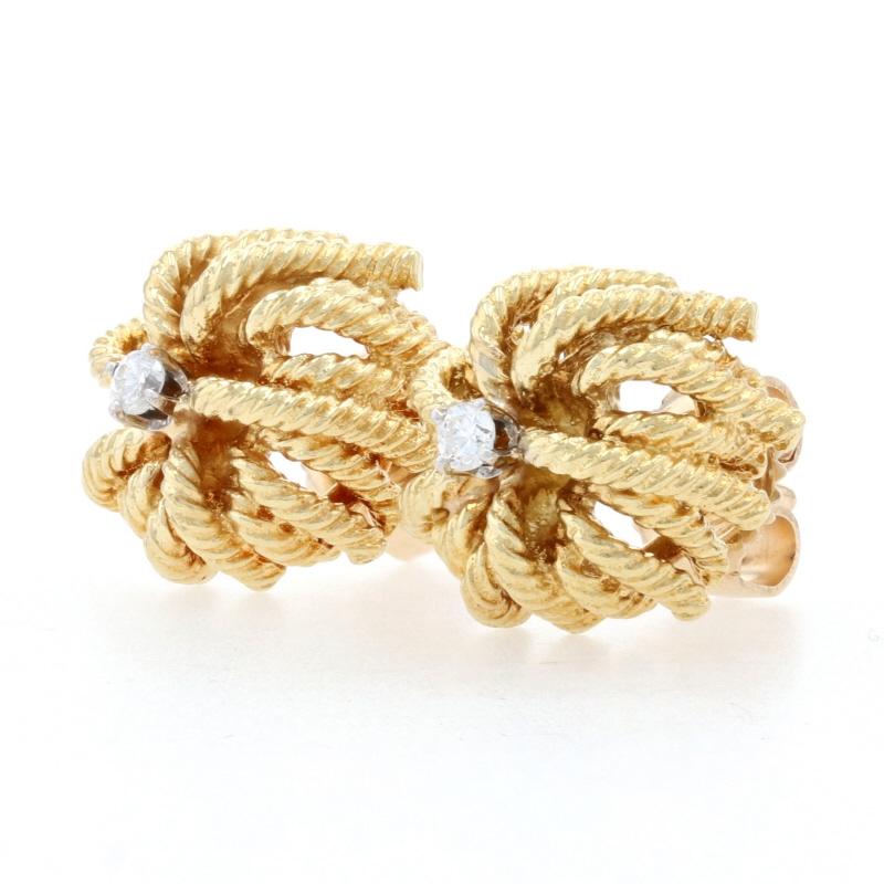 Metal Content: 18k Yellow Gold & 18k White Gold

Stone Information
Natural Diamonds
Total Carats: .06ctw
Cut: Round Brilliant 
Color: F - G
Clarity: VS1 - VS2

Style: Stud 
Fastening Type: Butterfly Closures
Features: Rope-Textured