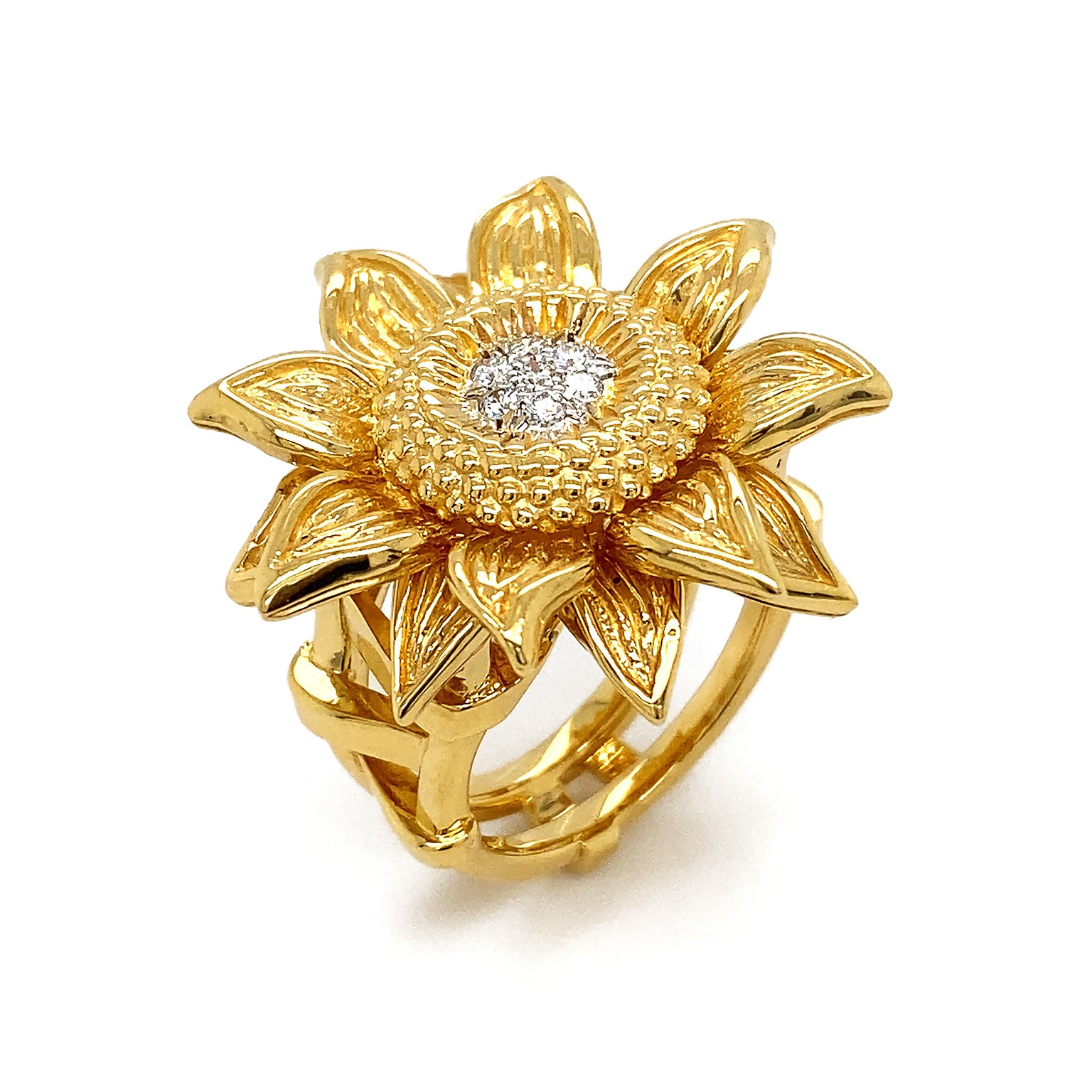 18k yellow gold glows as a fully bloomed sunflower. Petals are textured with subtle differences, creating realism and intrigue. Disk flowers encompass brilliant cut diamonds in the heart of the ring for a radiant light. The total weight of the