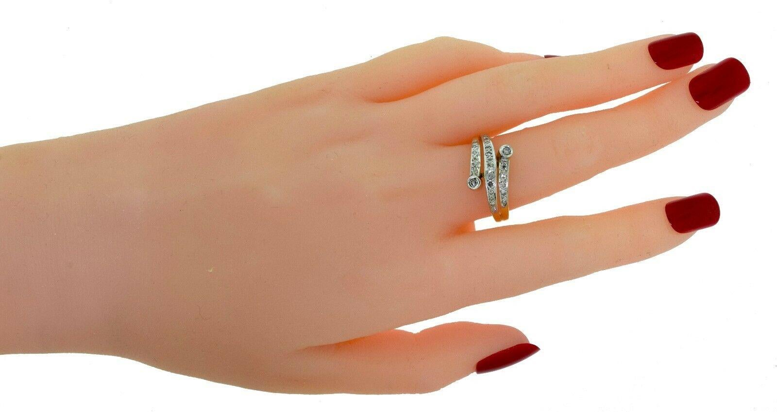 Ring Size: 8.75 (size)

Metal: Yellow Gold

Metal Purity: 18k

Stones: 24 Round Diamonds

Diamond Color: I - J

Diamond Clarity: VS - SI

Diamond Weight: 0.75 ct

Total Item Weight (g): 4.5

Ring Width: 0.35 