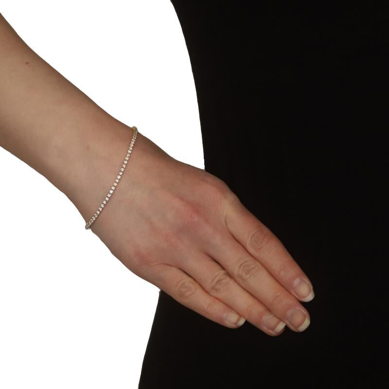 Metal Content: 14k Yellow Gold

Stone Information

Natural Diamonds
Carat(s): 2.80ctw
Cut: Round Brilliant
Color: G - H
Clarity: SI

Total Carats: 2.80ctw

Style: Tennis
Fastening Type: Tab Box Clasp with Two Side Safety