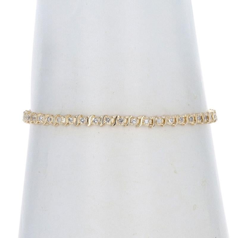 Metal Content: 14k Yellow Gold

Stone Information

Natural Diamonds
Carat(s): 1.00ctw
Cut: Single
Color: G - H - I
Clarity: SI1 - I1

Total Carats: 1.00ctw

Style: Tennis
Fastening Type: Tongue Box Clasp with Fold-Under Safety