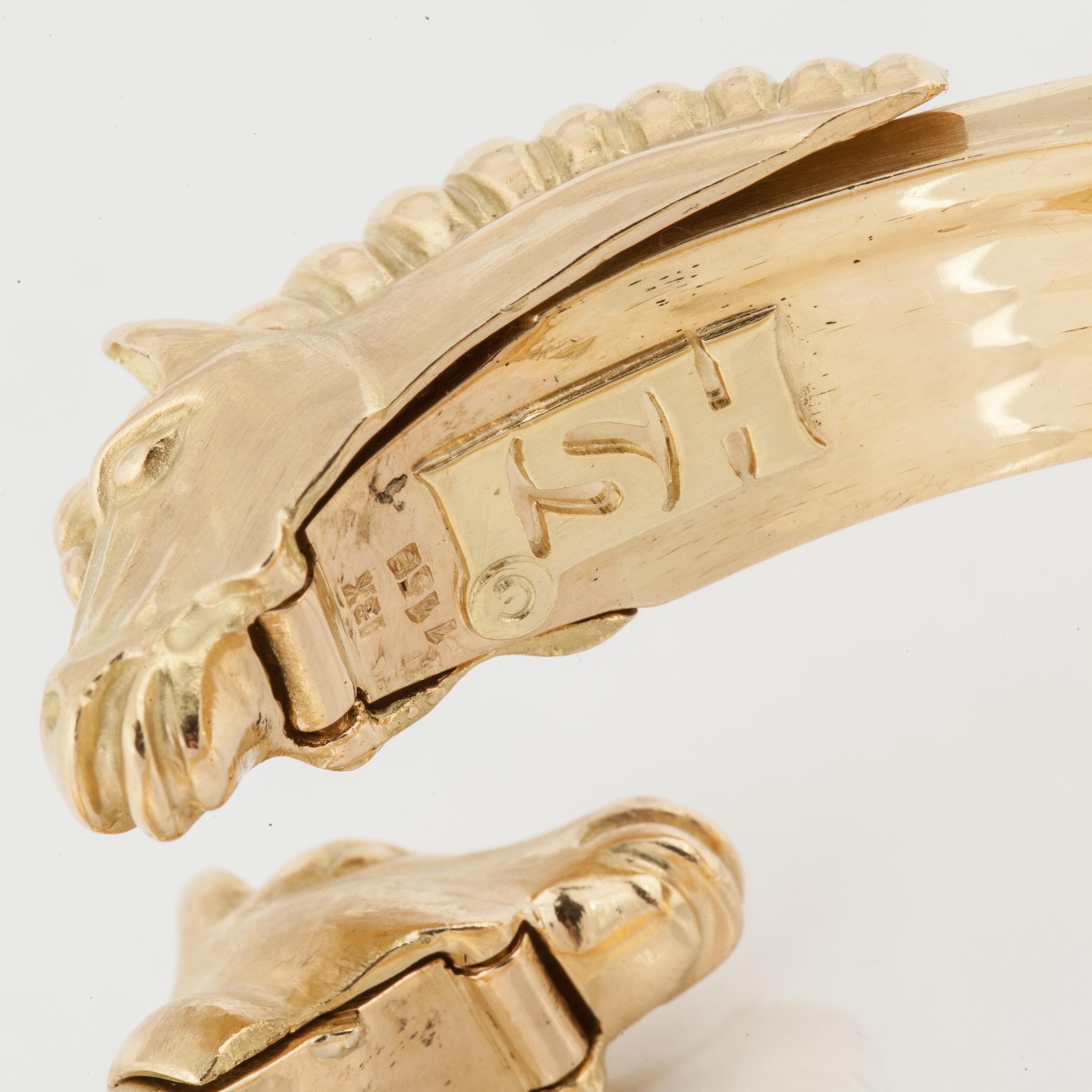 A princess-cut diamond tennis bracelet that includes a horse head jacket.  Bracelets are 14K and 18K yellow gold.  There are 66 princess-cut diamonds that total 7.20 carats; H-I color and VS-SI clarity.  The horse heads are hinged and lift up to