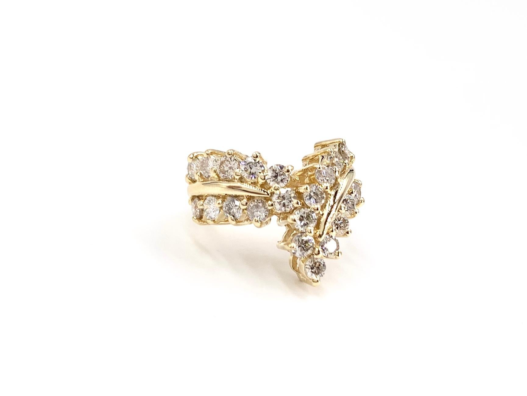 Fashionable and comfortable polished 14 karat yellow gold statement diamond curved V shape ring featuring 22 prong set round brilliant diamonds at approximately 1.25 carats total weight.
Diamond quality is approximately G color, SI1 clarity.
Finger